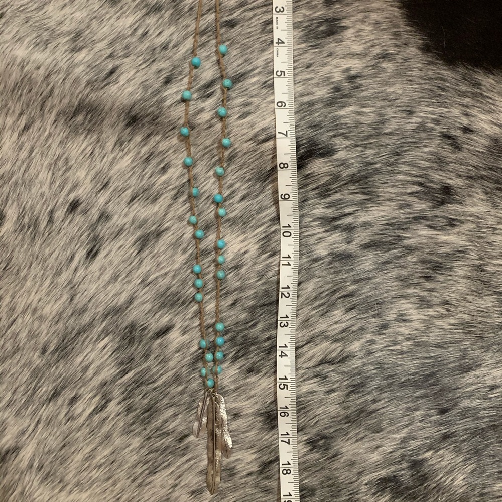 Long turquoise feather necklace